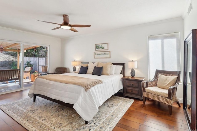 bedroom with access to exterior, crown molding, wood-type flooring, visible vents, and a ceiling fan