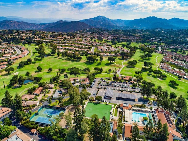 birds eye view of property featuring view of golf course and a mountain view