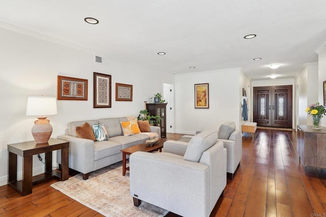 living room featuring baseboards, visible vents, dark wood-style flooring, crown molding, and recessed lighting