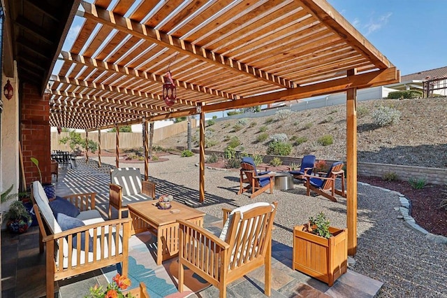 view of patio with a fenced backyard, a pergola, and an outdoor living space with a fire pit