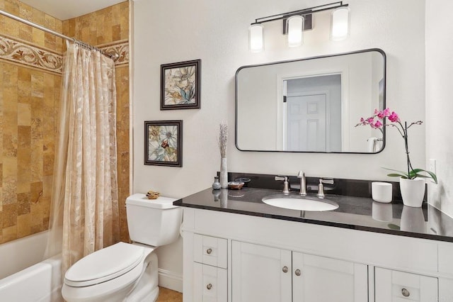 bathroom with toilet, shower / tub combo, and vanity