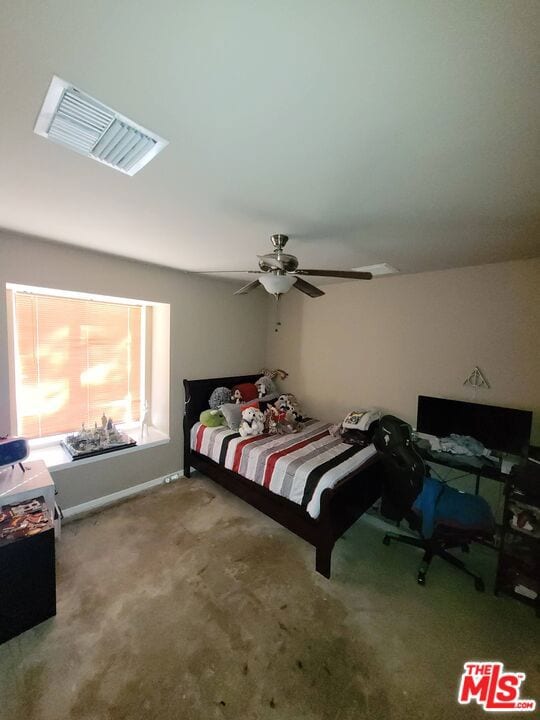 carpeted bedroom with ceiling fan