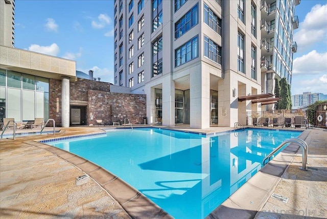 view of pool featuring a patio area