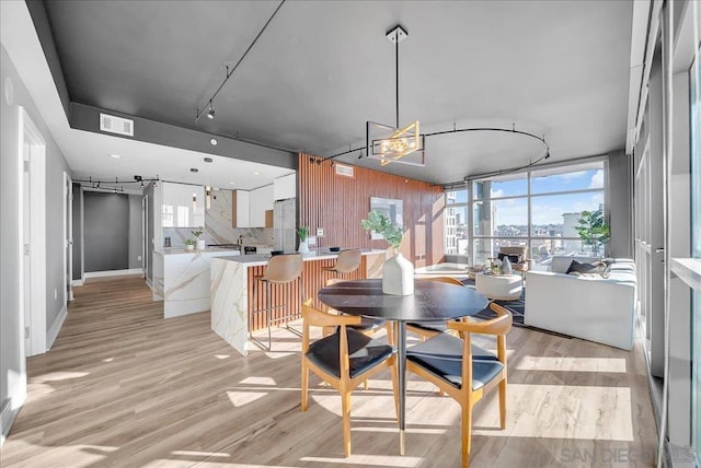 dining space featuring light hardwood / wood-style floors