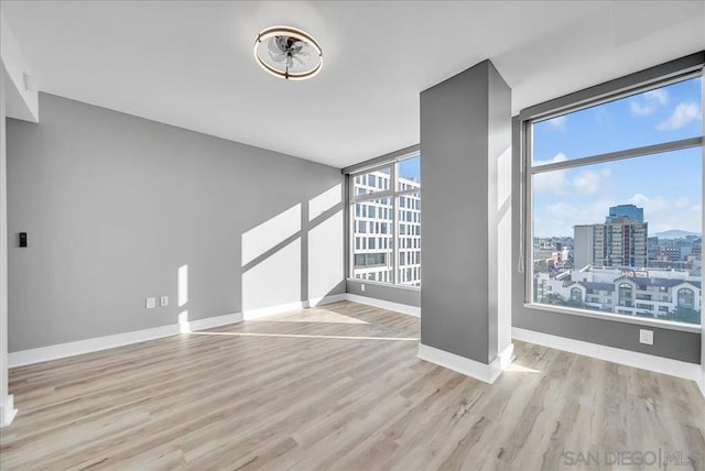 unfurnished living room featuring light hardwood / wood-style flooring