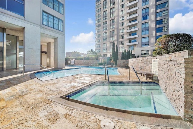 view of pool featuring a patio