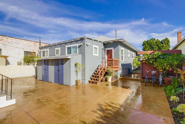 back of property with a patio area