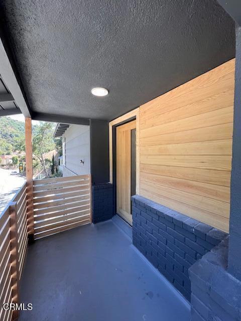 view of patio with a balcony