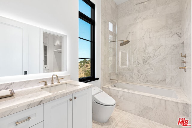 bathroom with vanity and tiled shower / bath