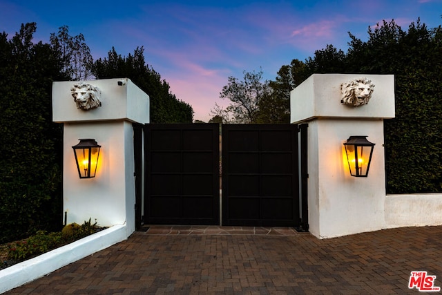 view of gate at dusk