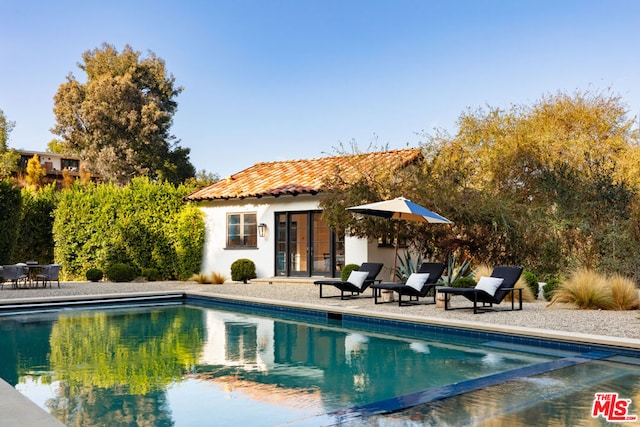 view of pool featuring a patio