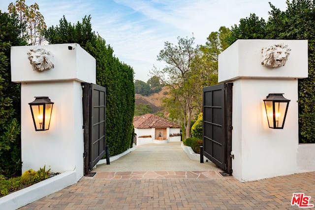 view of gate with a mountain view