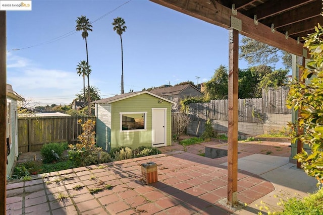 view of patio with a shed