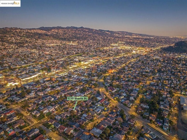 aerial view at dusk with a mountain view