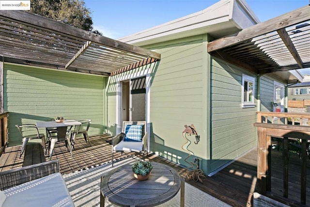 deck featuring an outdoor hangout area and a pergola