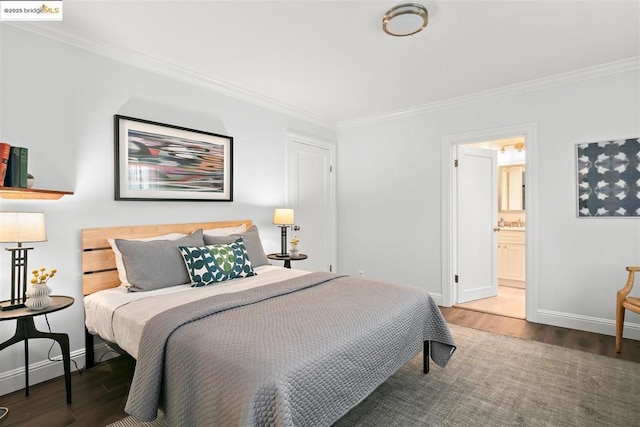 bedroom with crown molding, connected bathroom, and hardwood / wood-style floors