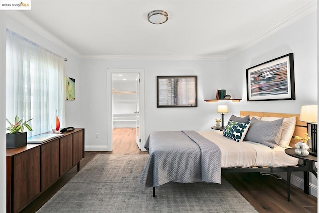 bedroom featuring hardwood / wood-style flooring and ornamental molding