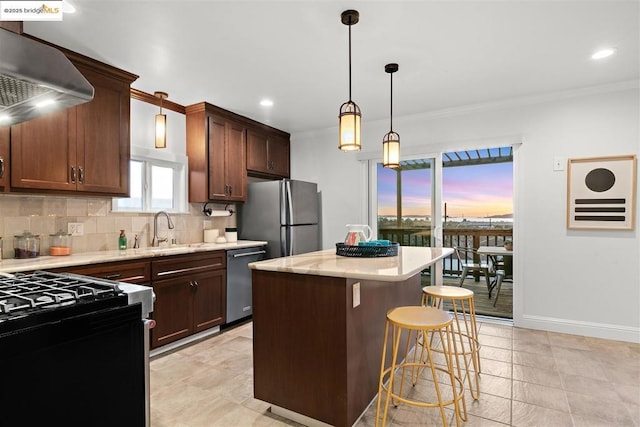 kitchen with crown molding, a breakfast bar area, stainless steel appliances, a center island, and ventilation hood