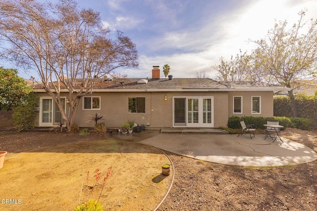 back of house with a patio area