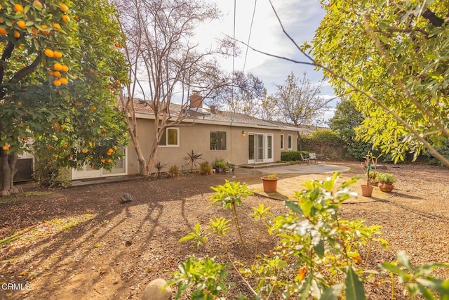 rear view of property with a patio