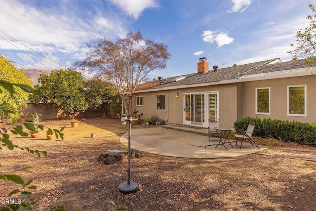 back of property with a patio area