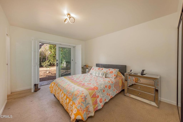 carpeted bedroom with access to outside