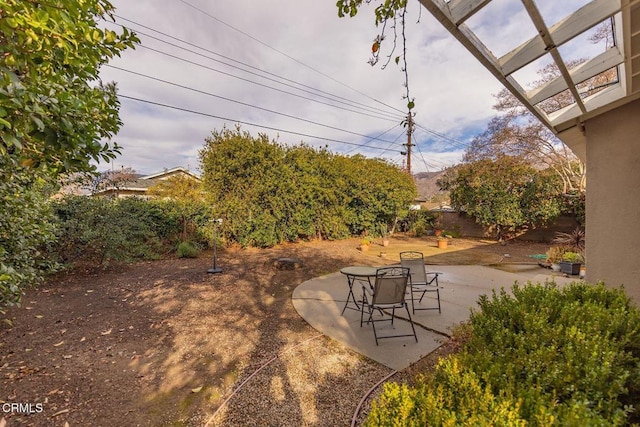 view of yard with a pergola and a patio