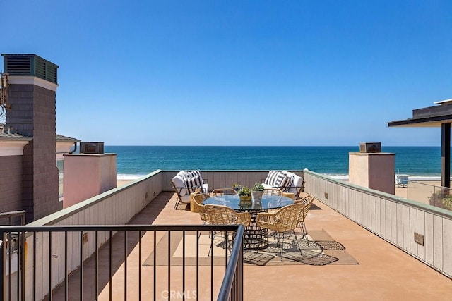 balcony featuring a water view and a view of the beach