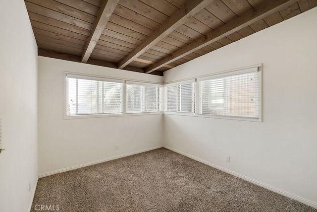 carpeted empty room with vaulted ceiling with beams and wood ceiling