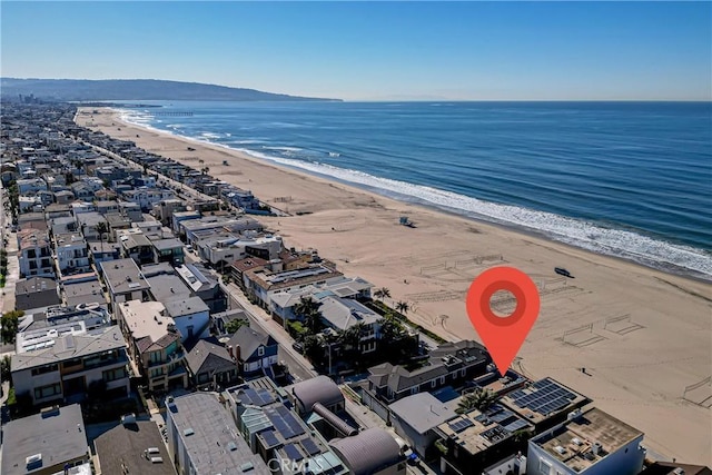 bird's eye view with a water view and a view of the beach