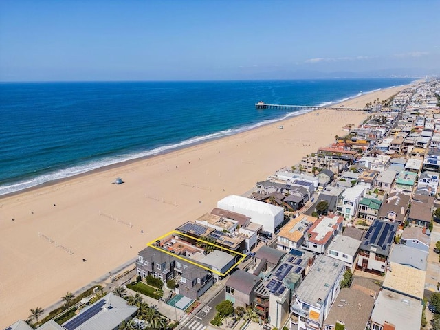 drone / aerial view featuring a view of the beach and a water view