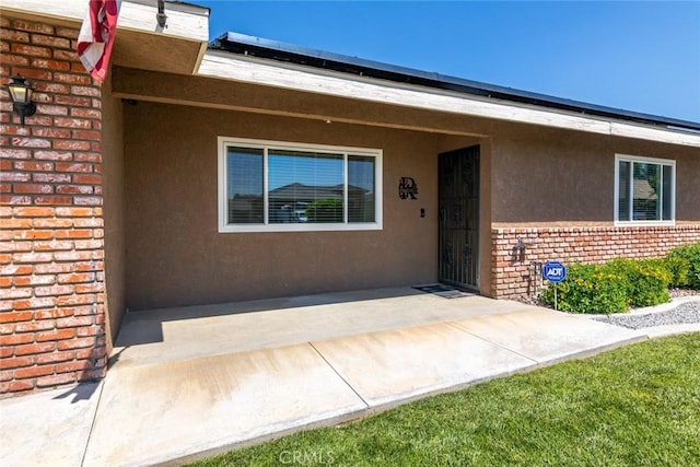 property entrance with a patio area