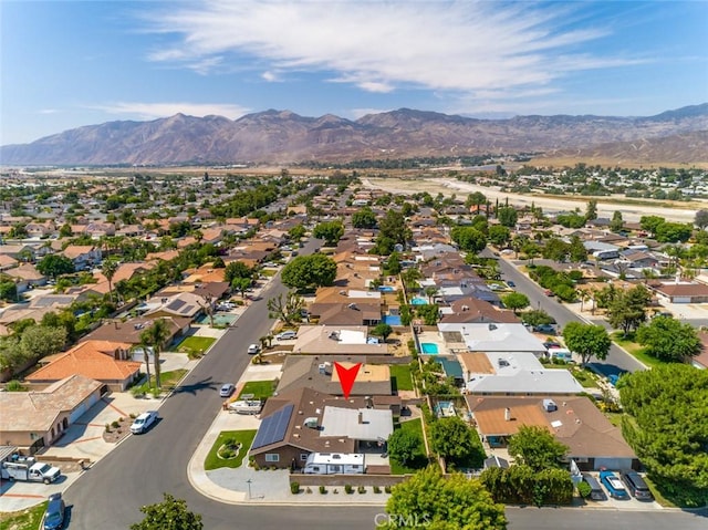 drone / aerial view featuring a mountain view