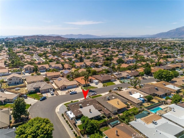 birds eye view of property featuring a mountain view