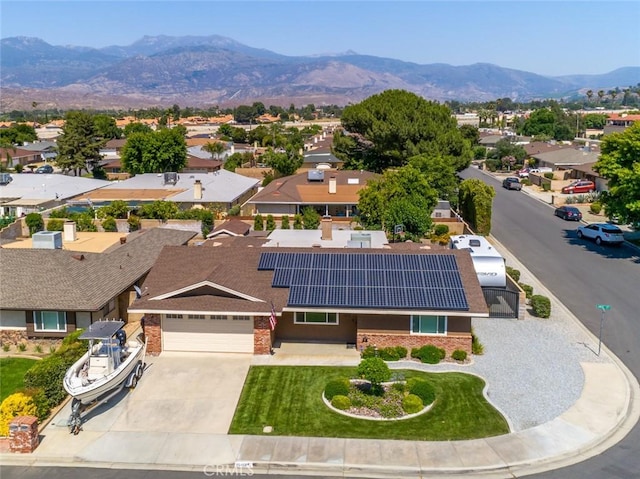 birds eye view of property with a mountain view