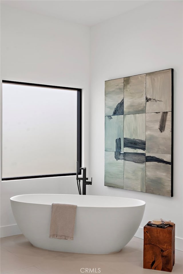 bathroom featuring a tub to relax in