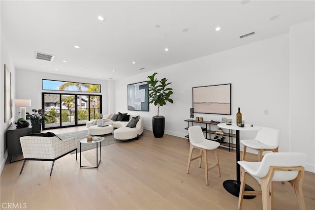 living room with light hardwood / wood-style floors