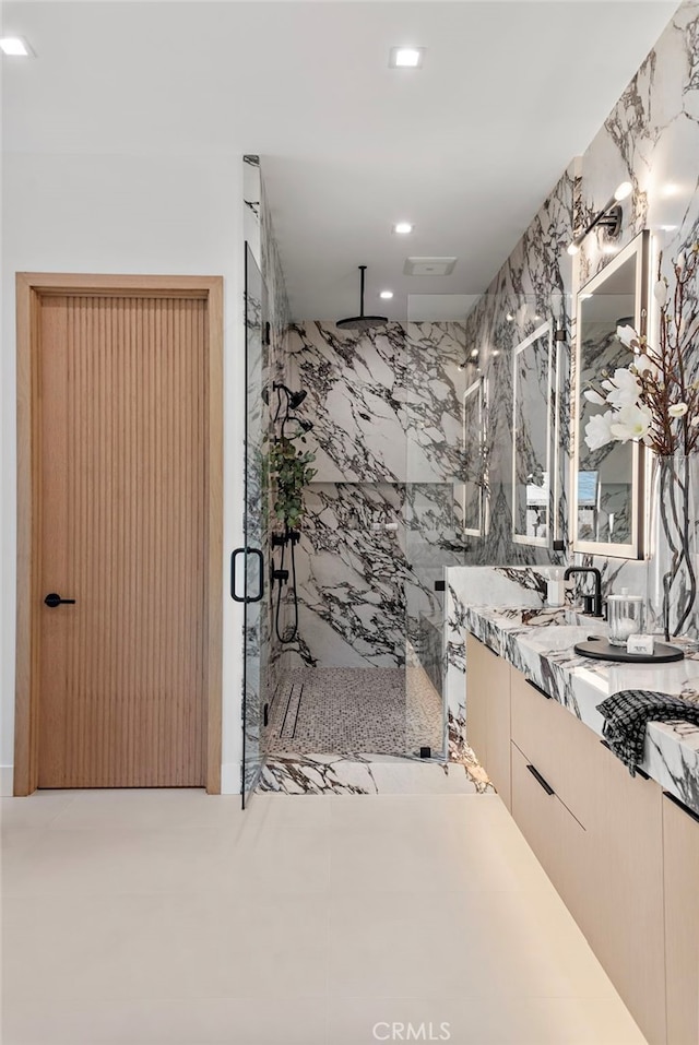 bathroom featuring vanity and walk in shower