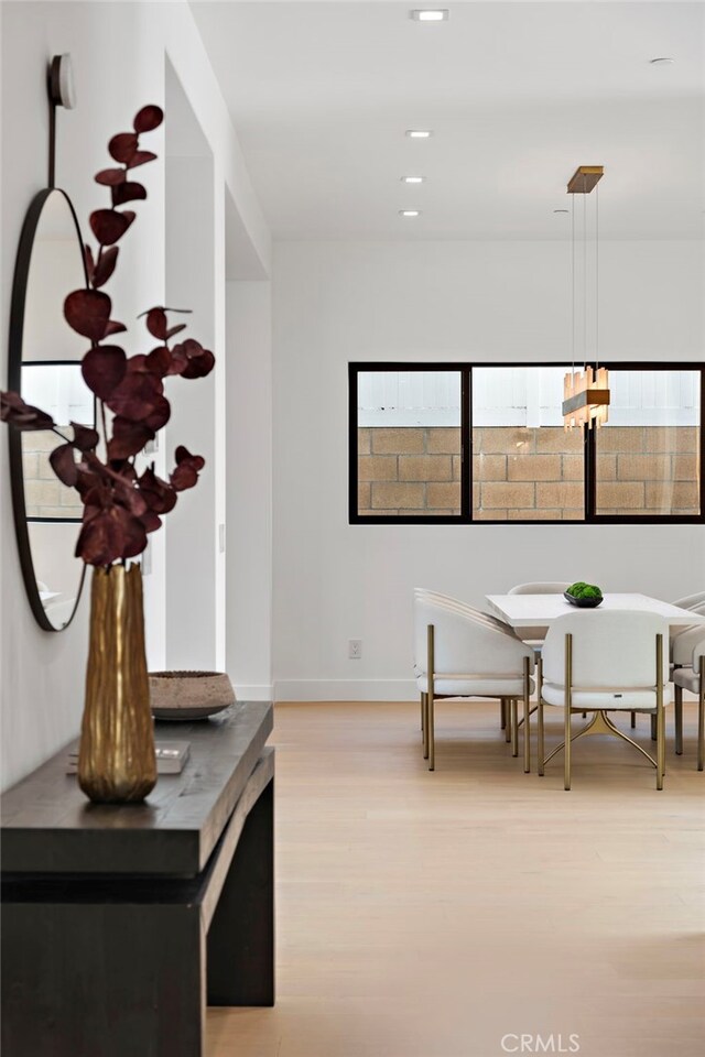 hallway with light hardwood / wood-style flooring