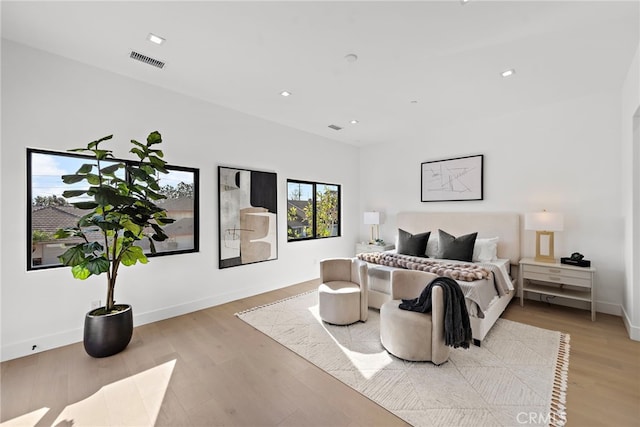 bedroom with light hardwood / wood-style flooring