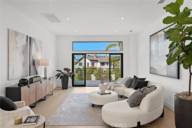 living room with light hardwood / wood-style floors