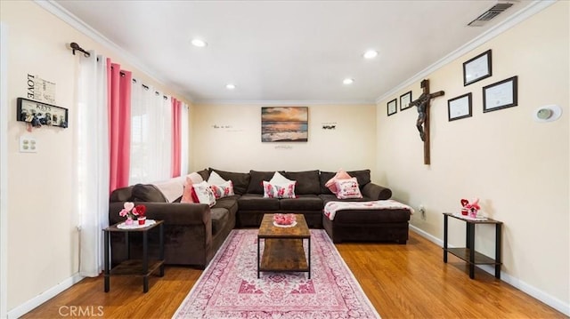 living room featuring wood-type flooring and ornamental molding