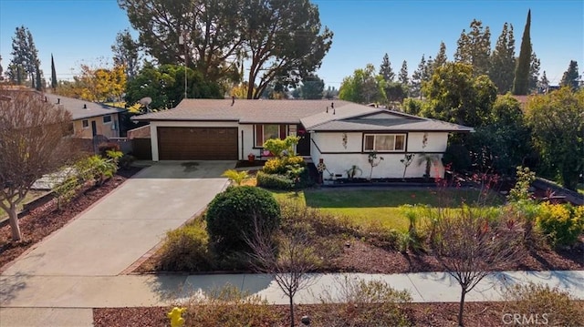 ranch-style house featuring a garage