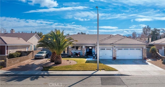 ranch-style house with a garage and a front lawn