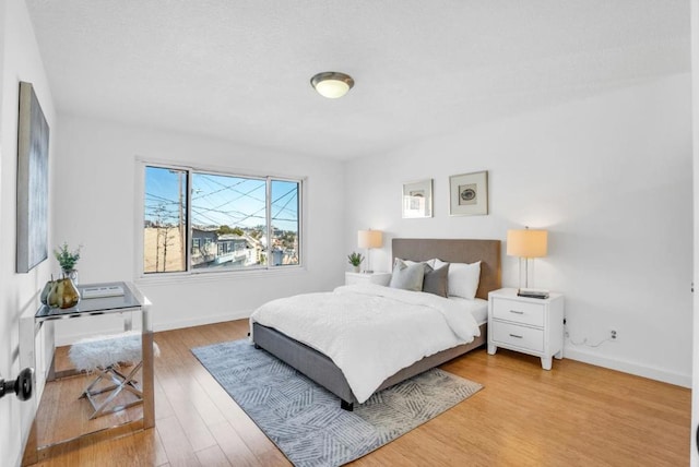 bedroom featuring hardwood / wood-style flooring