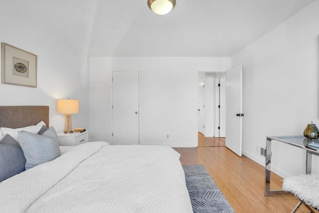 bedroom with light hardwood / wood-style flooring