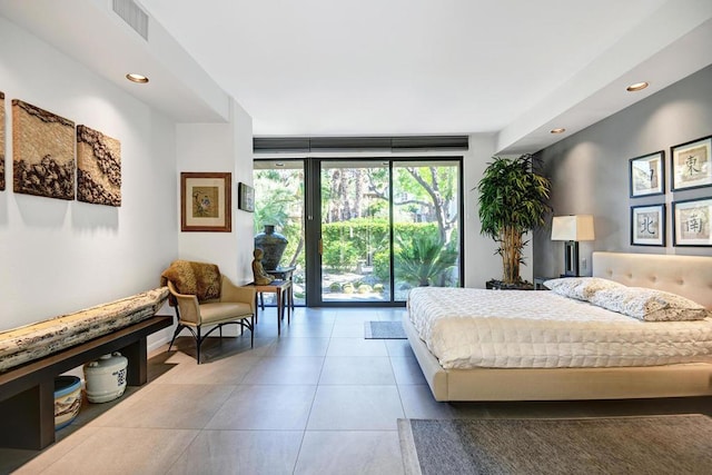 tiled bedroom featuring floor to ceiling windows and access to outside