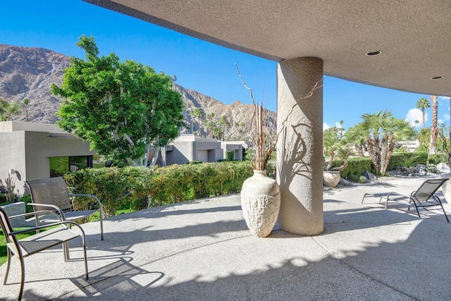 view of patio / terrace featuring a mountain view