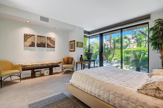 bedroom featuring access to exterior and multiple windows