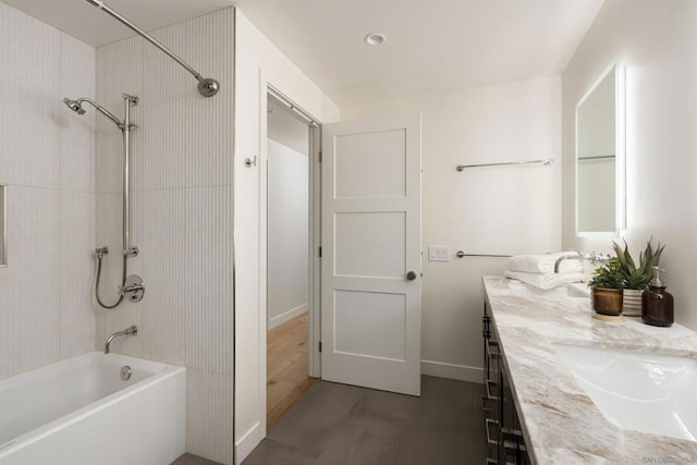 bathroom with vanity, wood-type flooring, and bathtub / shower combination